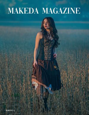 Fashion magazine cover showing model in dark dress standing in grassy field against turquoise sky.