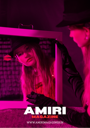 Fashion magazine cover with bright pink lighting and dramatic shadows on dark background.