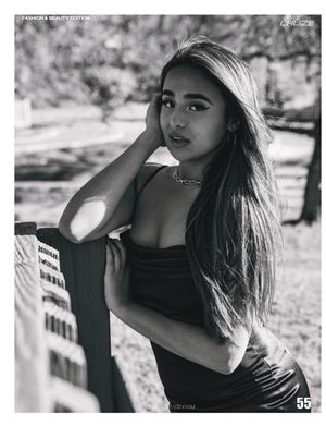 Black and white portrait photo in natural lighting with artistic composition.