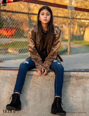 Urban fashion shot featuring metallic jacket and combat boots against autumn backdrop.
