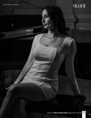 Black and white portrait in a fitted white top displaying elegant minimalist fashion.