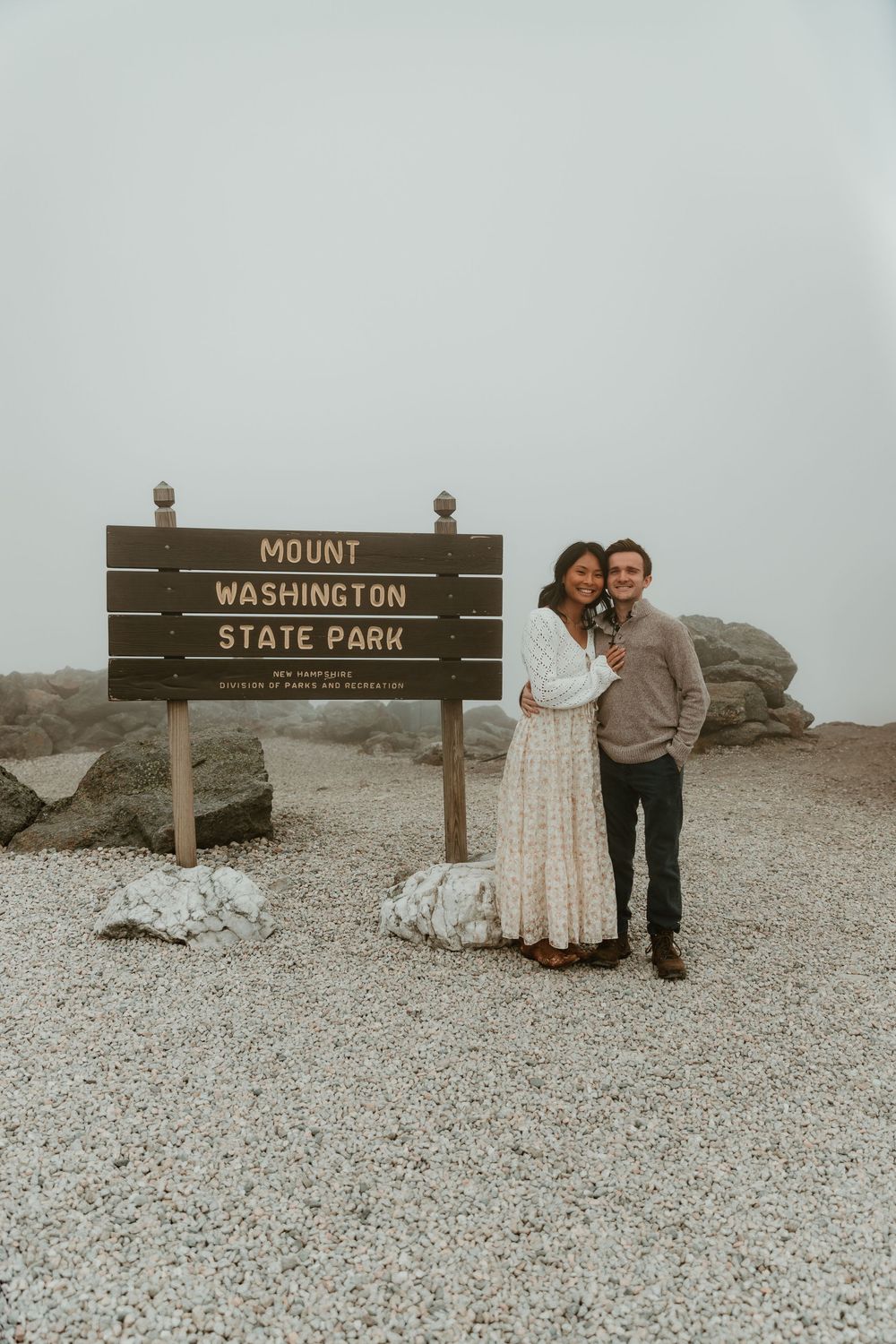 Scenic photo session at Mount Washington State Park sign on cloudy day.