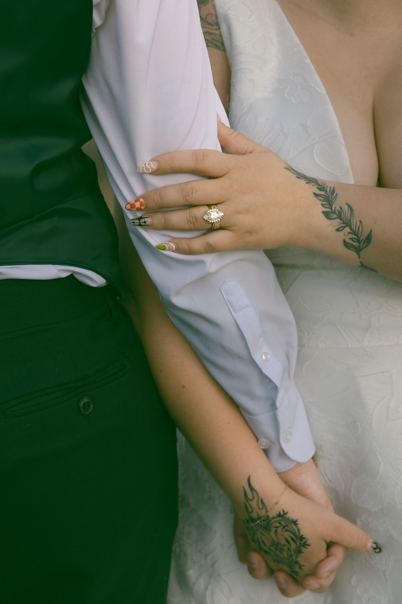 LGBTQ couple holding hands during romantic elopement at blue ridge mountain overlook near Asheville, North Carolina