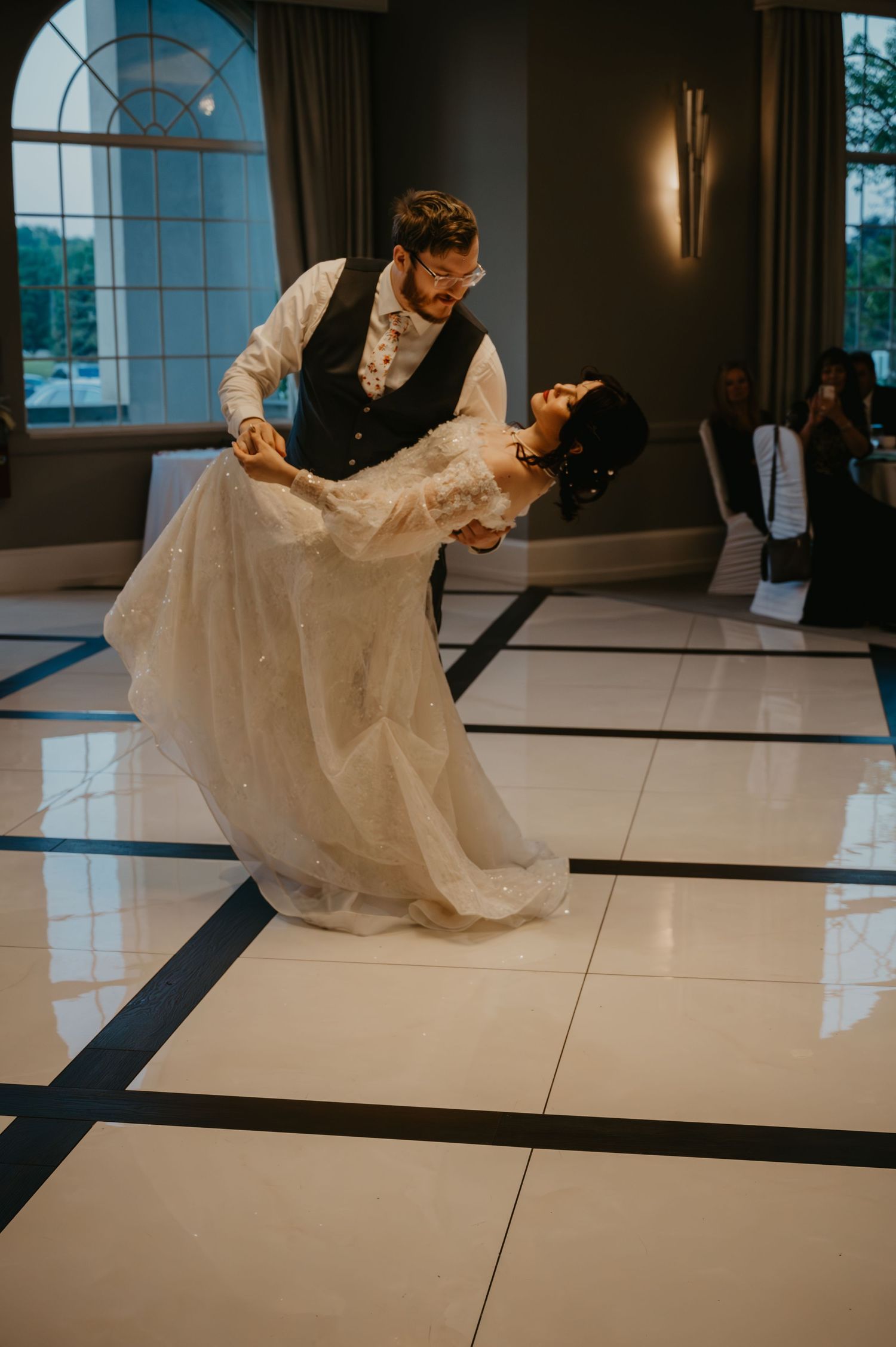 bride and groom dancing in ballroom