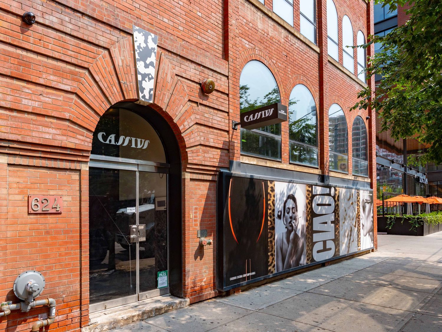 Exterior view of historic red brick building with arched windows and architectural details.