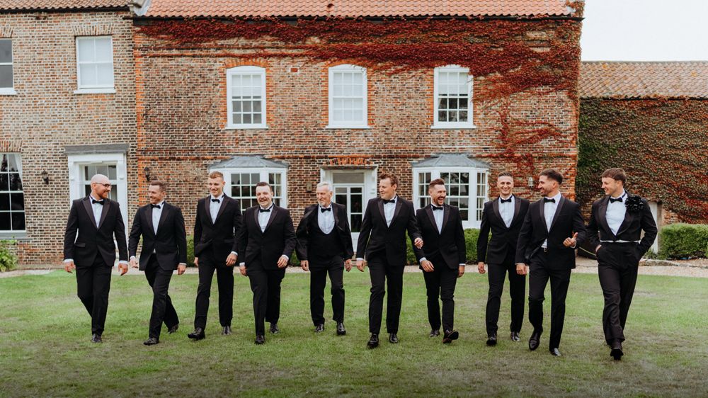 Groom party having fun during photoshoot outside the wedding venue, Hornington Manor
