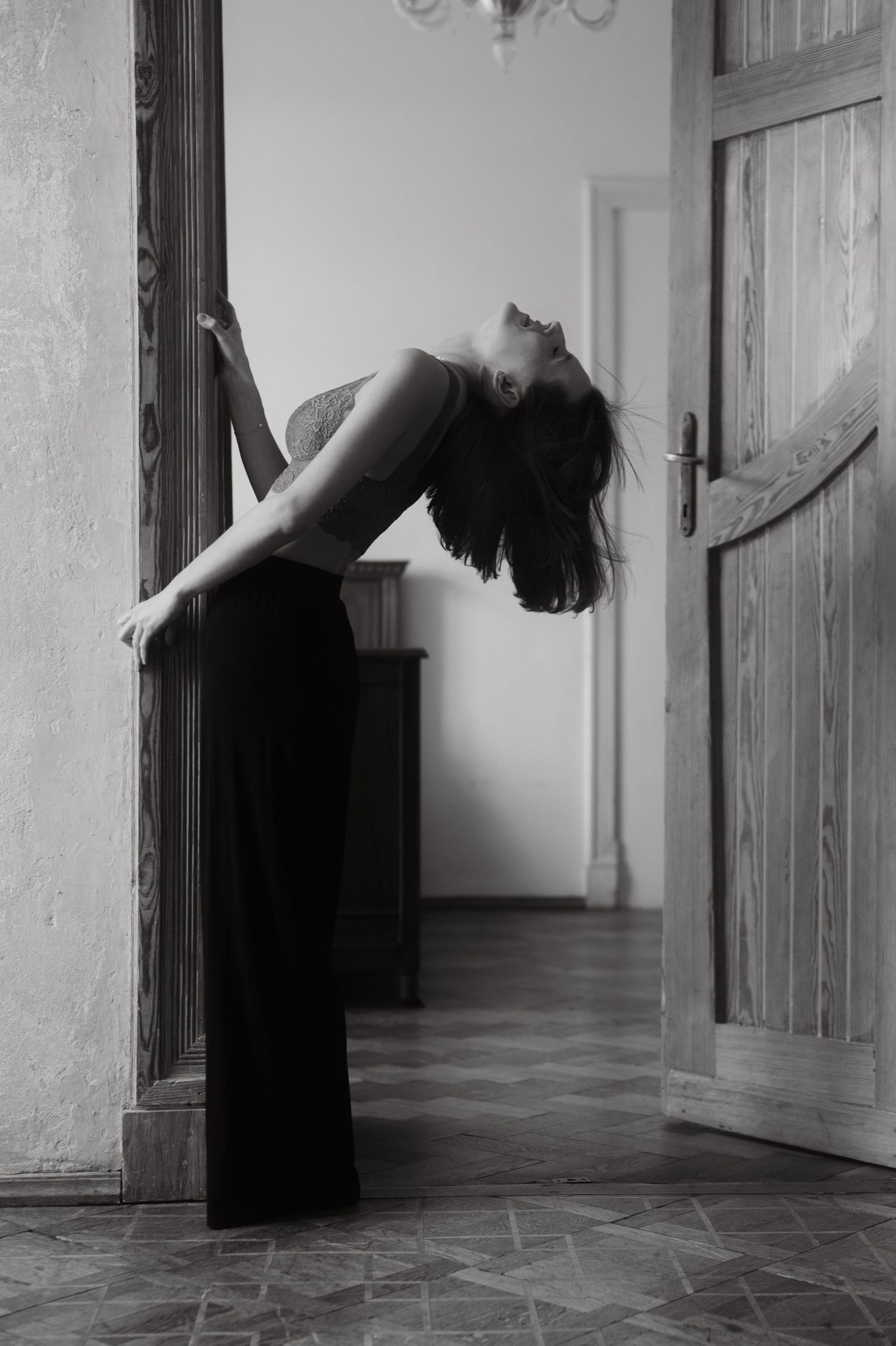 Artistic black and white photo series showing graceful floating movements in a hallway.