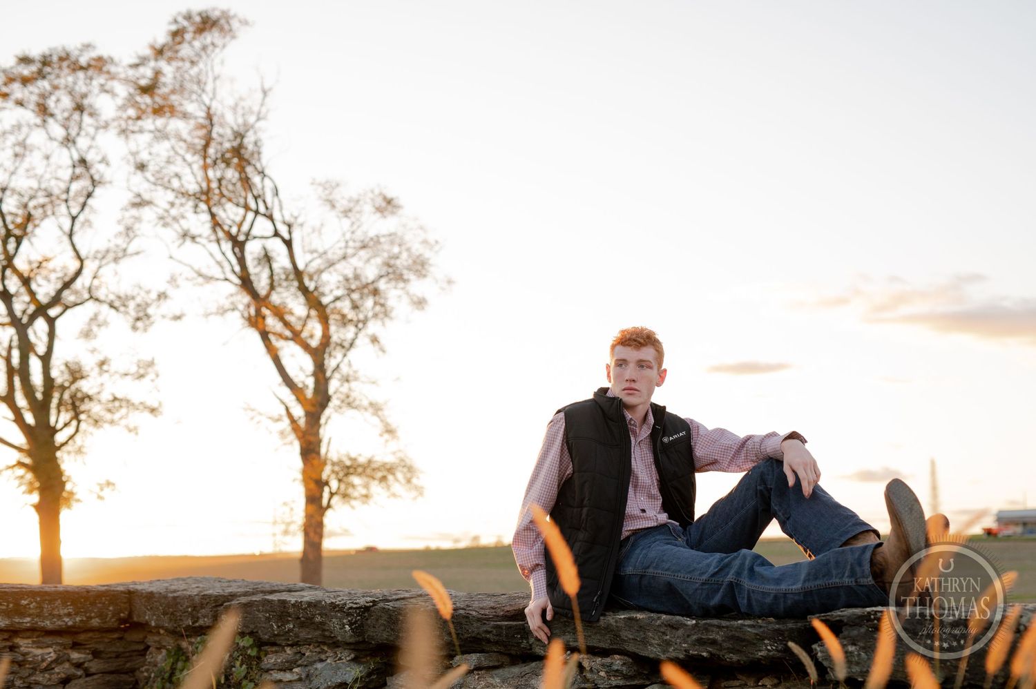 A serene outdoor portrait with golden sunset lighting amid autumn trees.