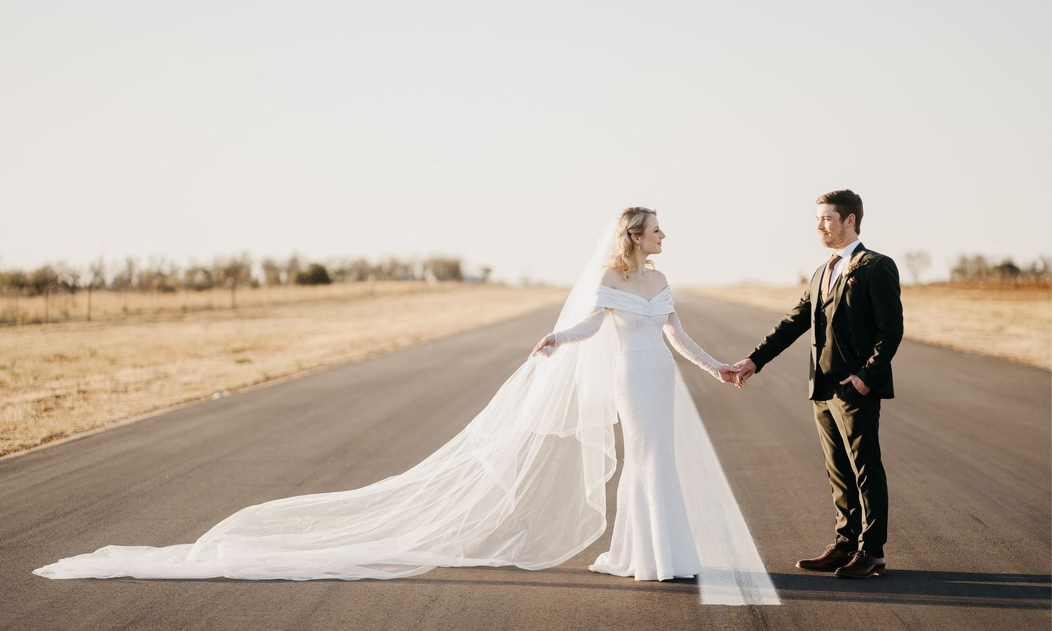 Joyful bride and groom, hand in hand, walking together with hearts full of love, ready to begin their forever. at Bona Bona South Africa