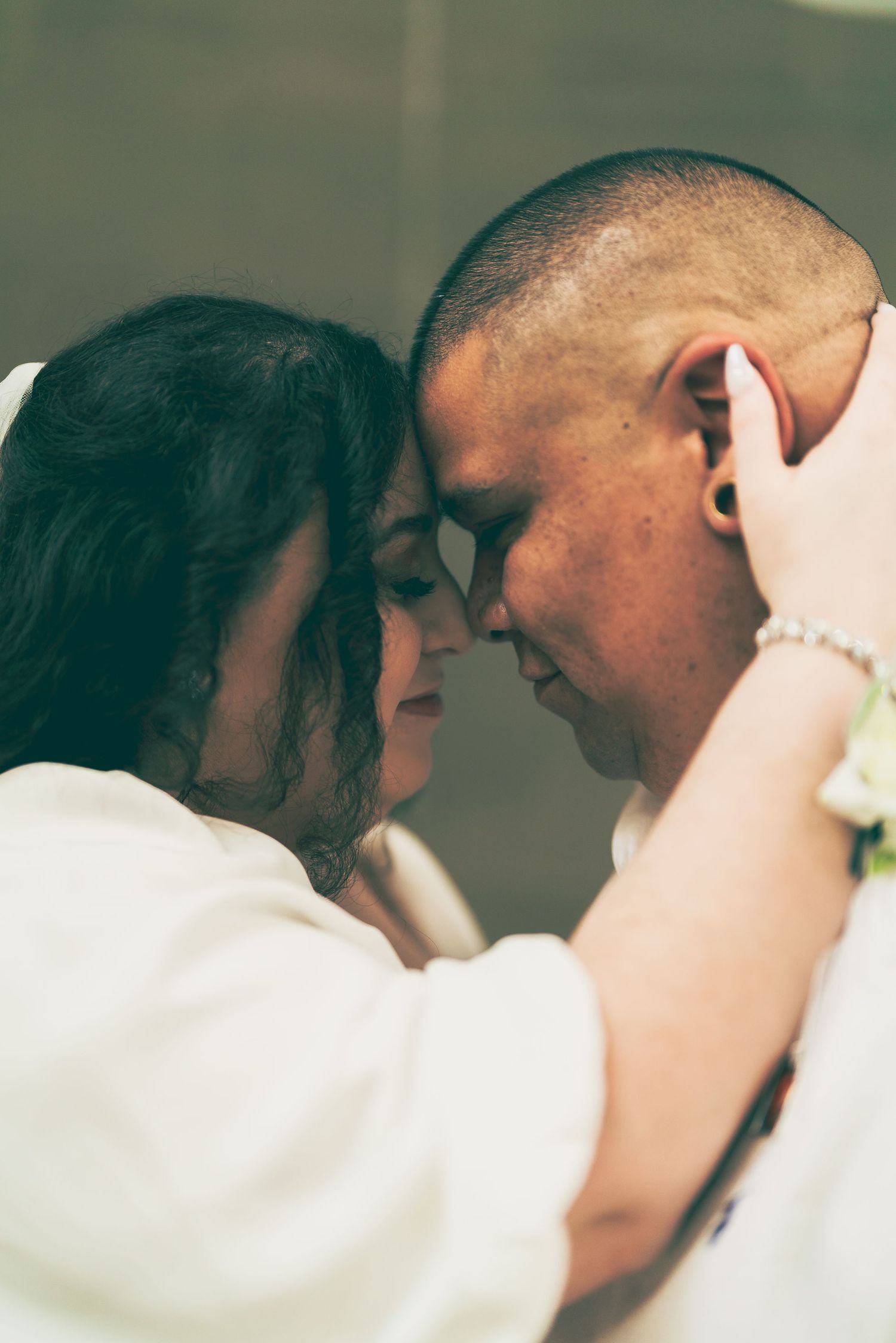 Bride and groom, touching forehead in Rockport, Texas