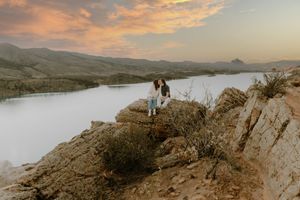 Couple sits and embraces each other for candid couples, engagement photos, sunset, elopement, cinematic photos in Fort Collins, Colorado