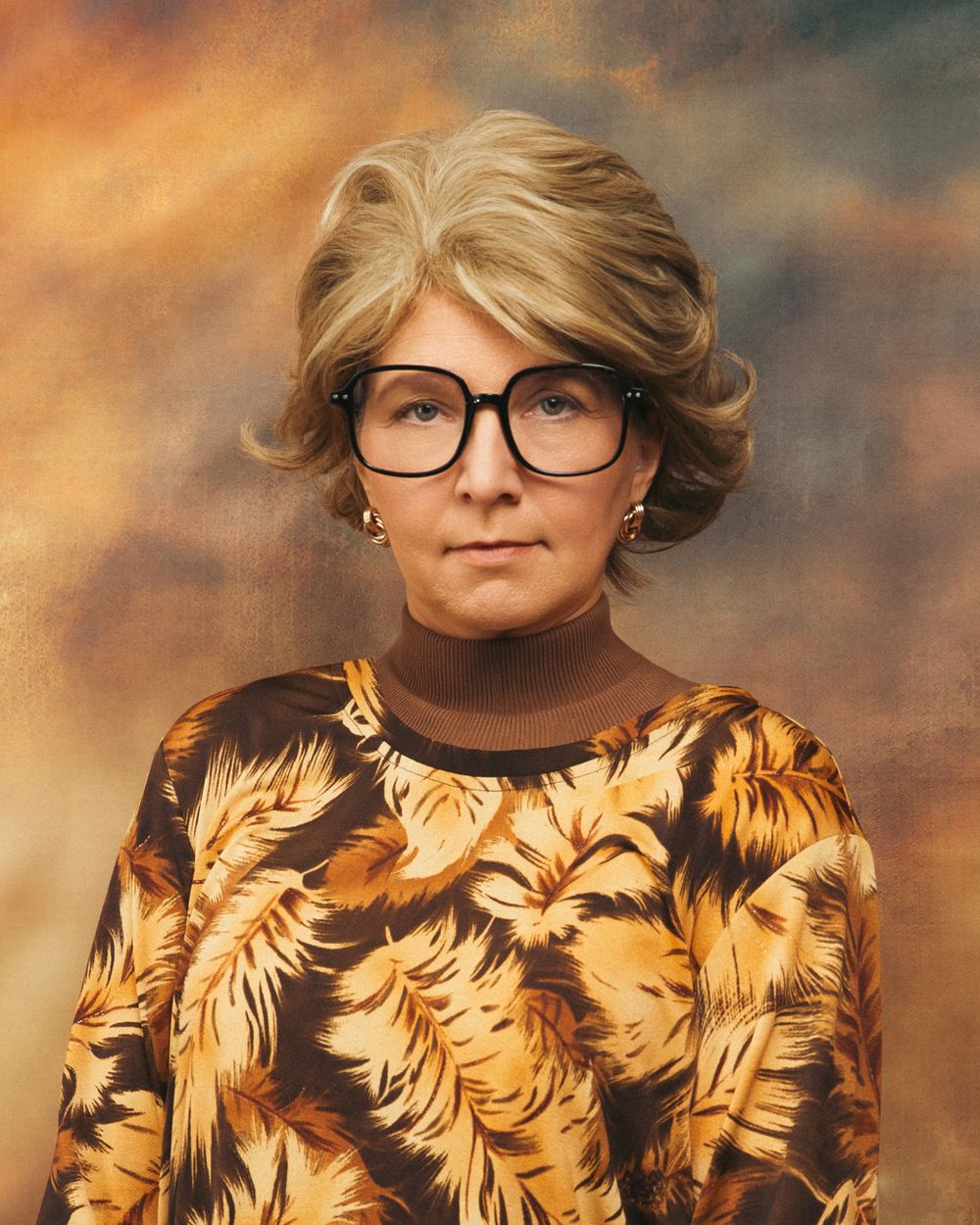 Awkward portrait of a lady in a brown retro top, big glasses, blonde 70's hair, staring blankly, against a brown mottled backdrop