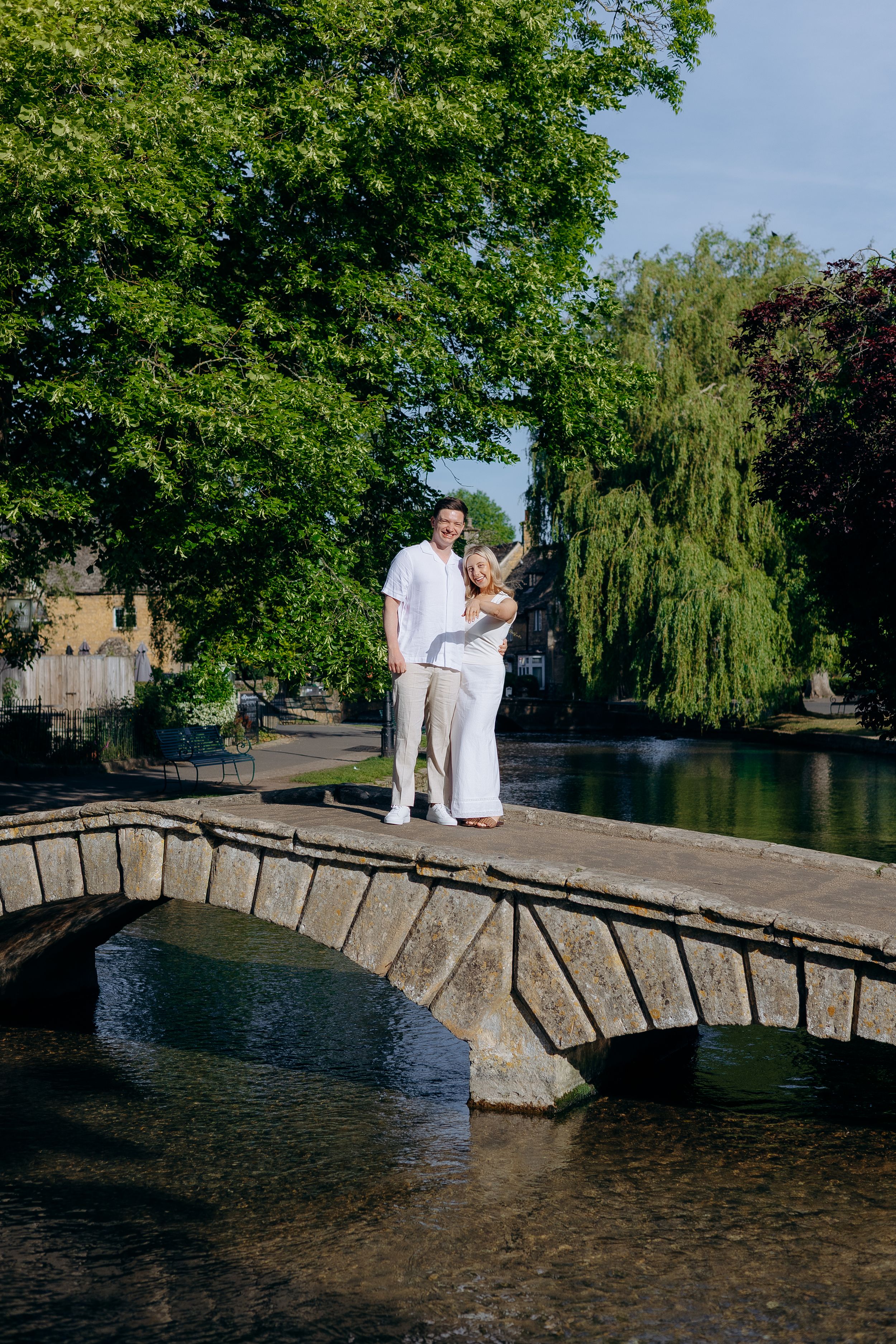 Engagement photoshoot in Bourton-on-the-Water after a surprise proposal.