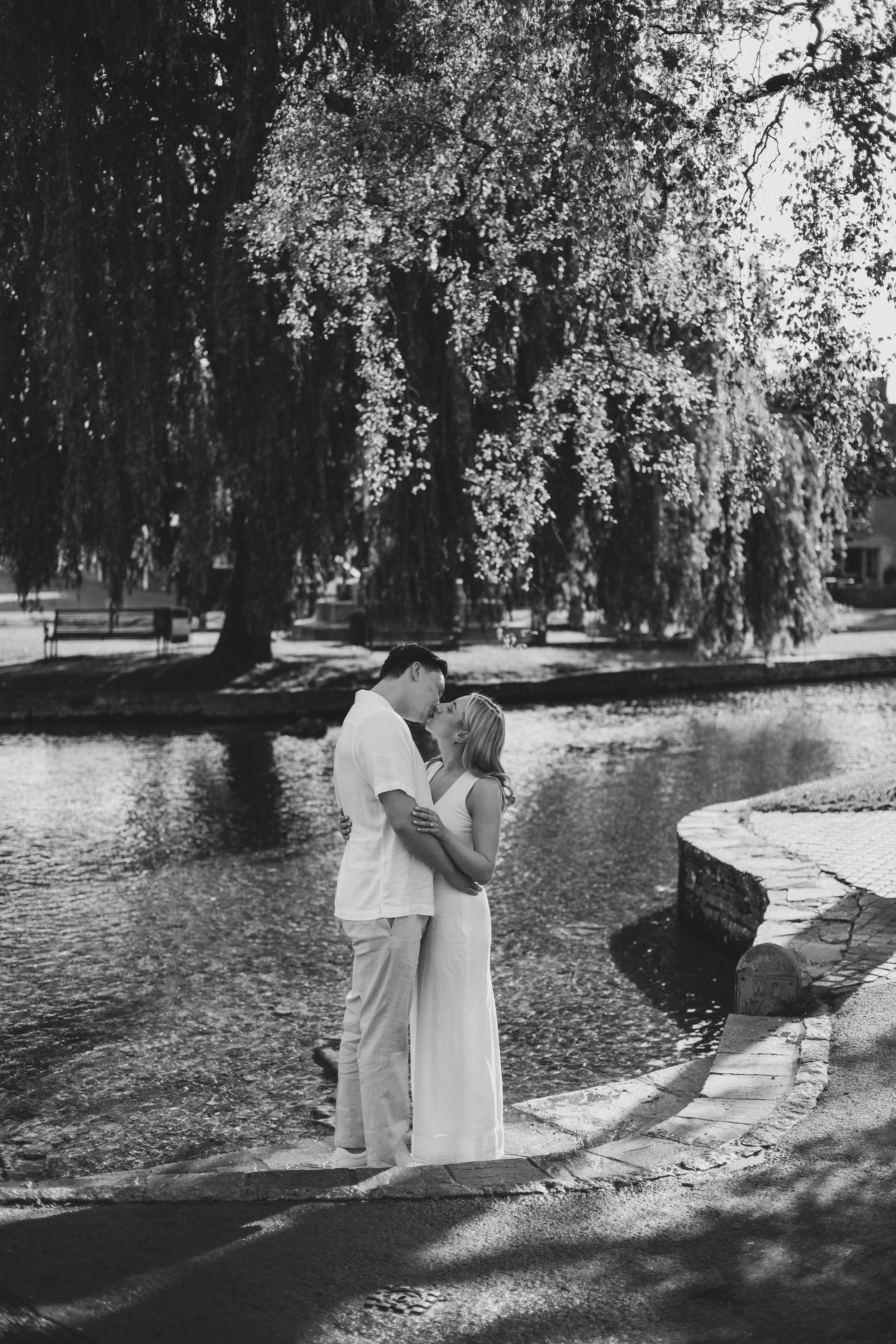 Bourton-on-the-Water proposal photography with riverside views.
