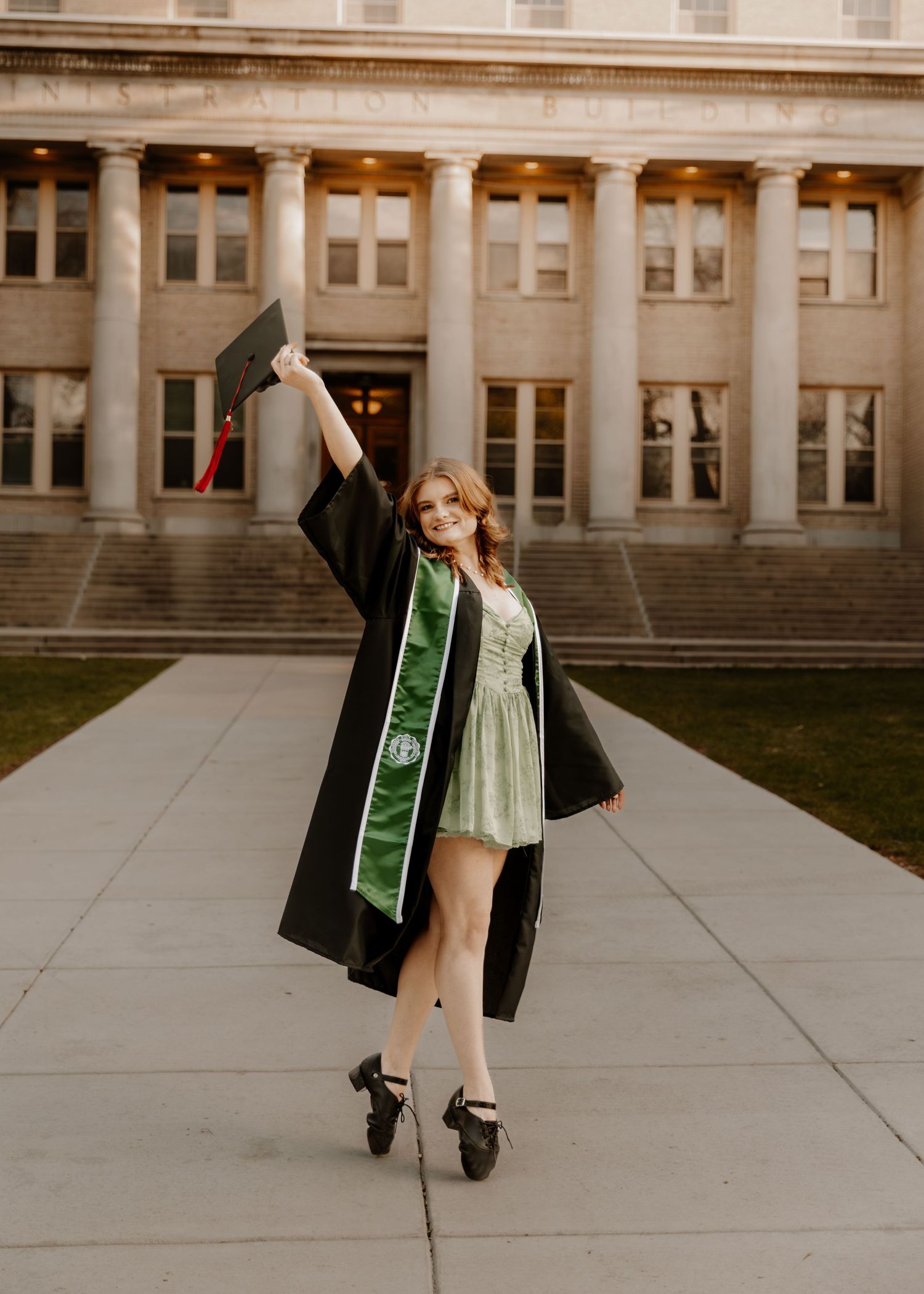 Girl stands and shows off her cap for graduation photos CSU (Colorado State University) graduation photos in Fort Collins, Colorado