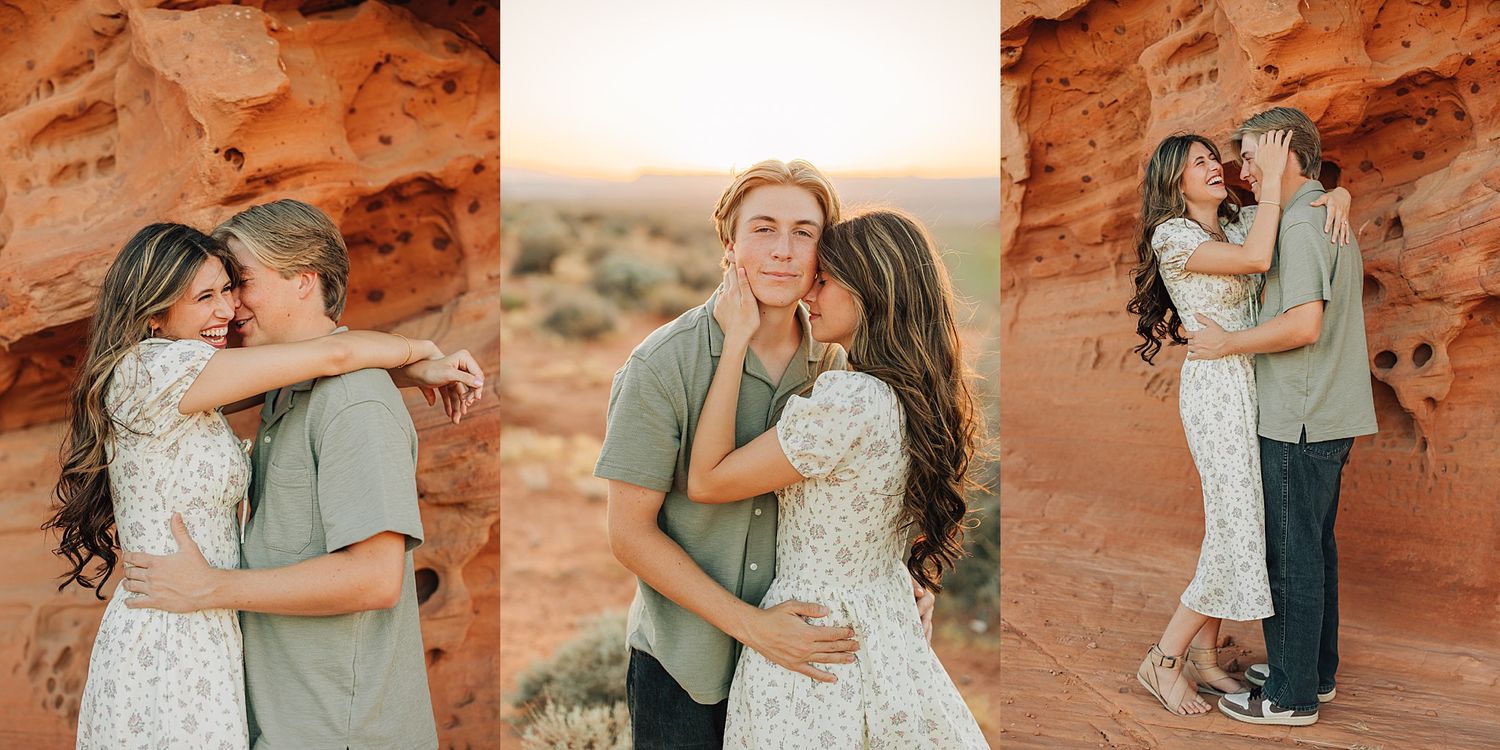 Couple embracing and kissing against red rock desert canyon backdrop during golden hour engagement photo session.