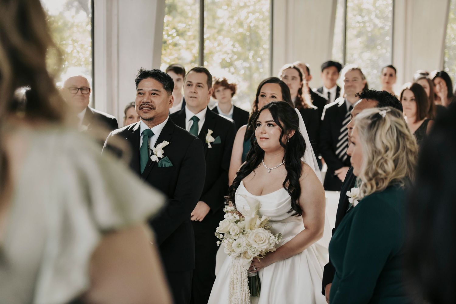 Emotional groom reaction as bride enters the chapel