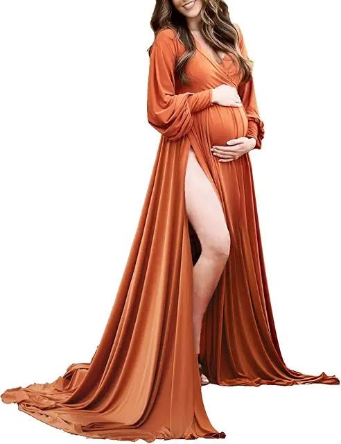 Pregnant woman wearing a rust orange long sleeve maternity gown with deep V-neck and front slit.