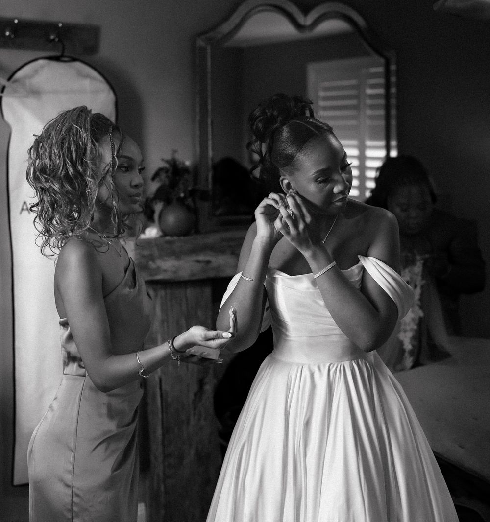 Black and white photo series showing a person in a white dress preparing and getting dressed for a formal occasion.