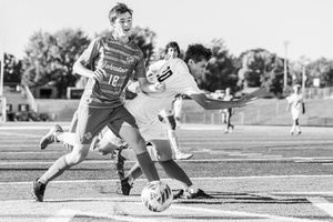 A series of black and white soccer action shots showing players sliding and making defensive plays on the field.
