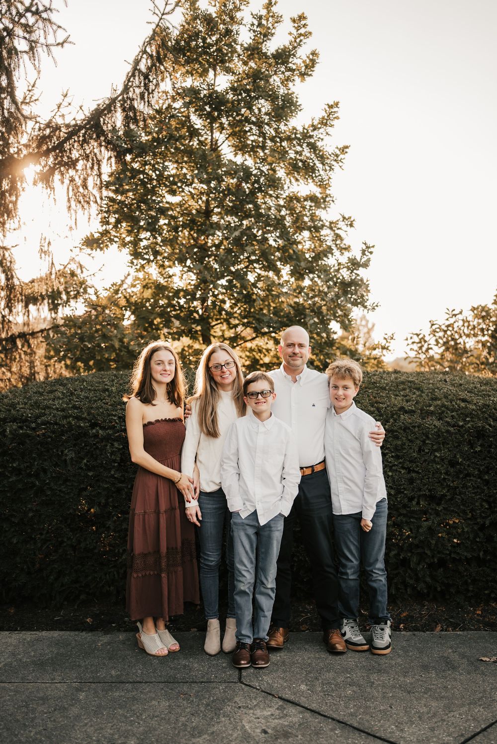 Candid moment of family laughing together during a fall photoshoot.