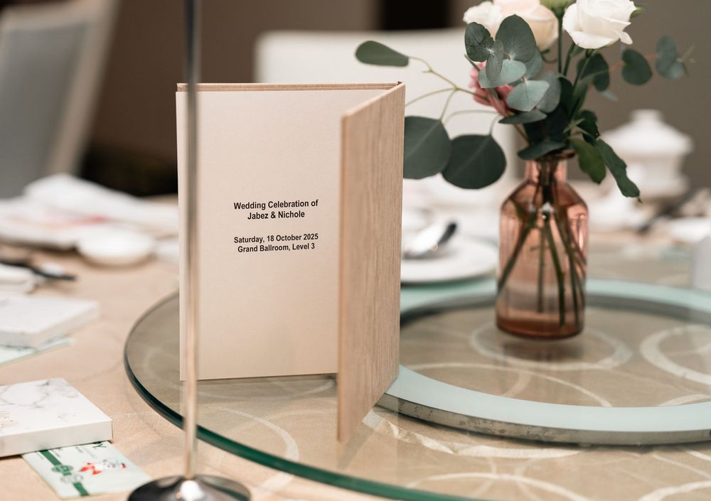 A close-up of elegant wedding table settings with soft pastel colors, floral centerpieces and delicate place cards.