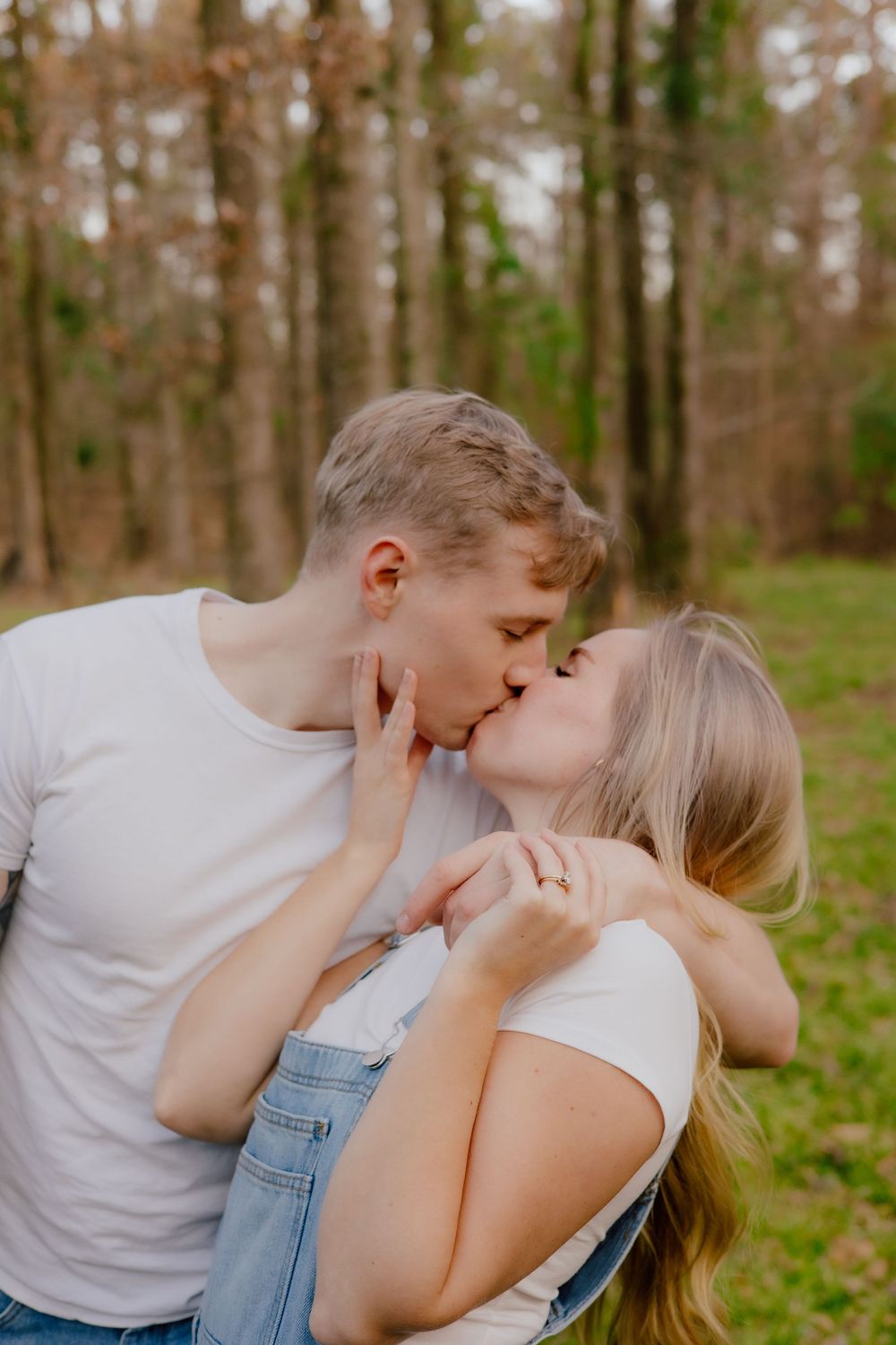 A romantic sequence of four photos showing an intimate embrace in a wooded outdoor setting.