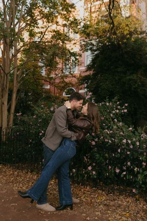 A sequence of playful poses in an autumn garden setting with fallen leaves and trees.