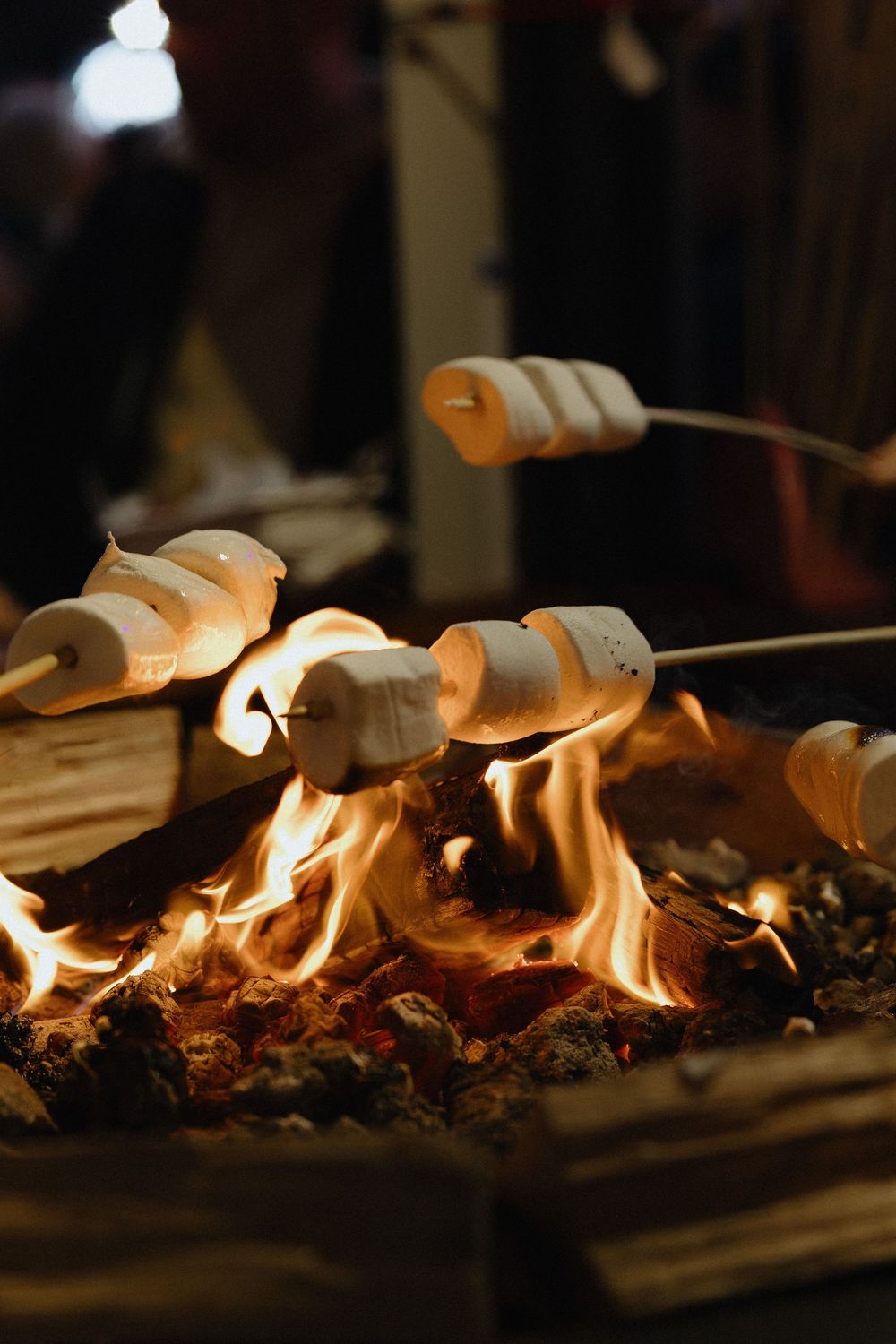 Close-up sequence of flames burning on a dark surface, creating a warm and dramatic lighting effect.
