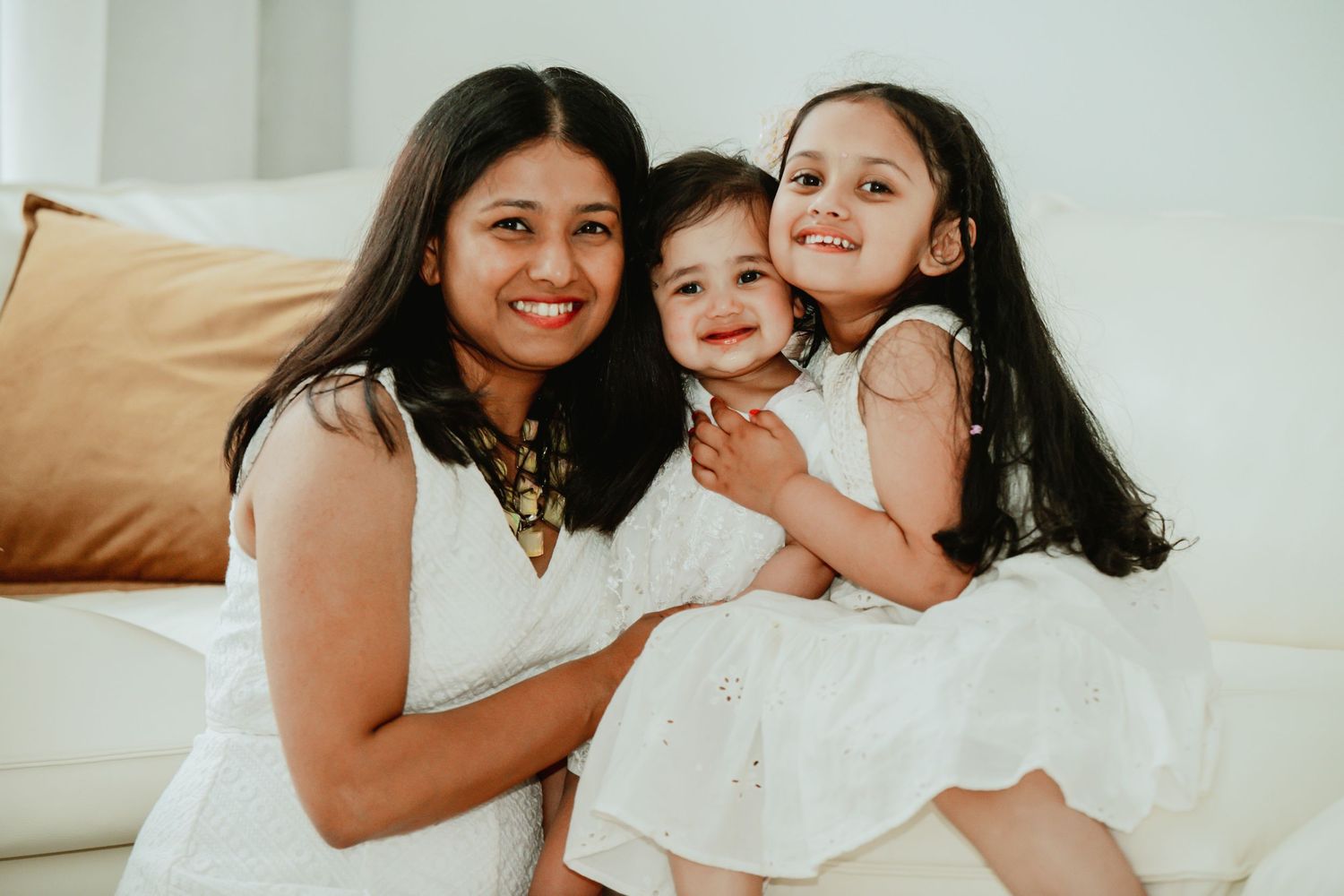 A loving family moment captured in a series of candid photos showing joyful embraces and genuine smiles.