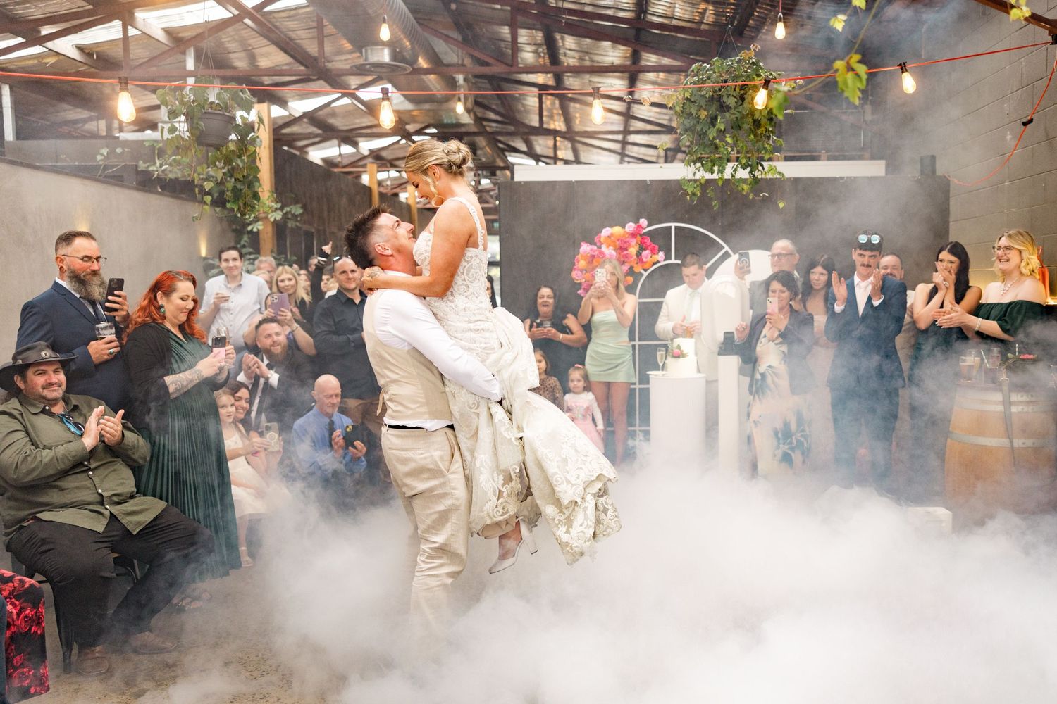 Wedding party celebration with smoke and sparkler effects creating a dramatic scene.