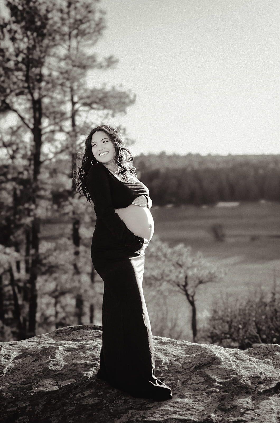 Denver maternity photography session at sunset in Castlewood Canyon Park in Castle Rock, Colorado.