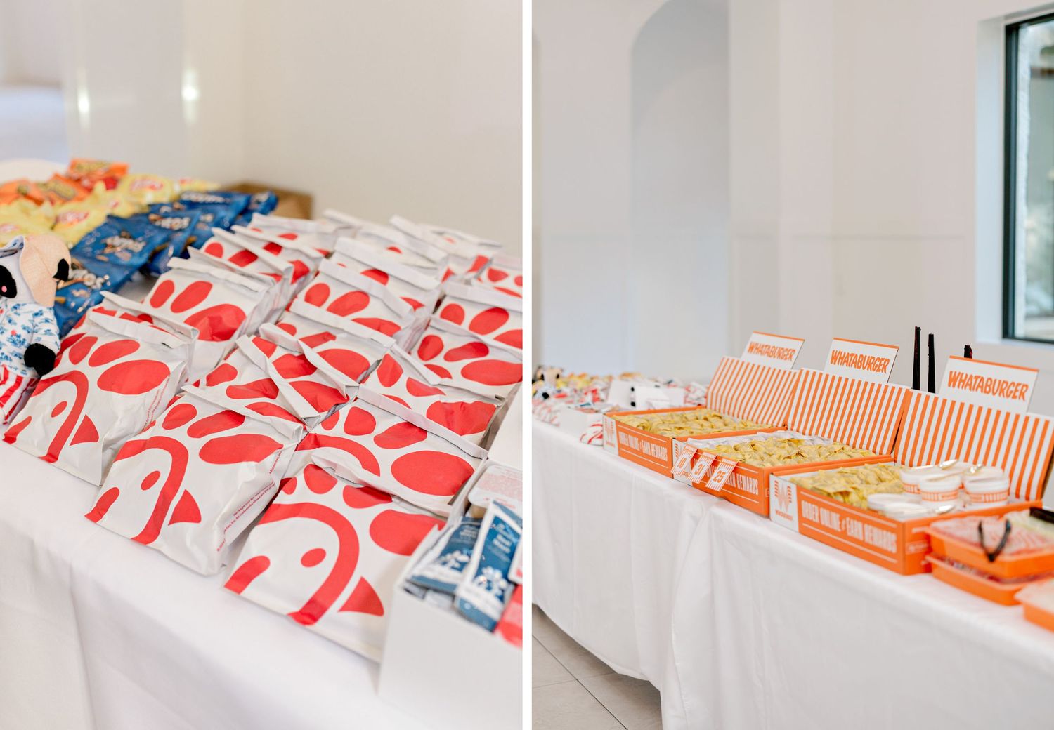 Fast food takeout bags and boxes arranged on white tables for a catered event setup.