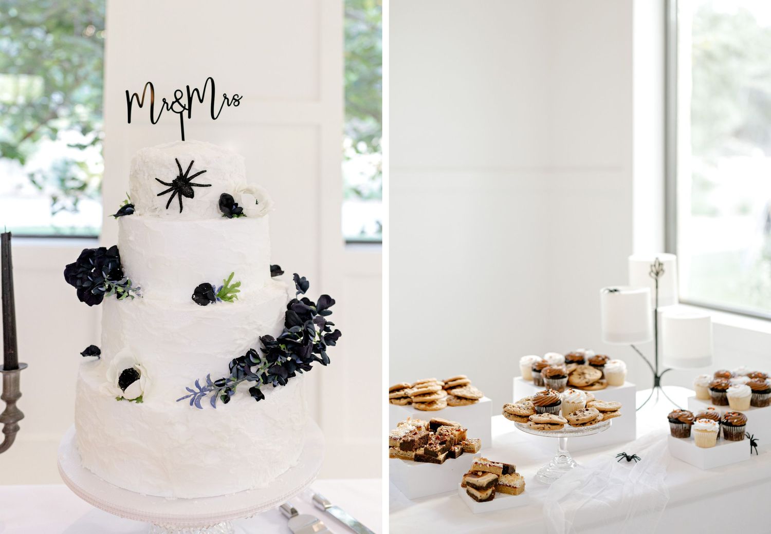 White wedding cake with black floral accents sits on a table alongside dessert displays at a modern reception.