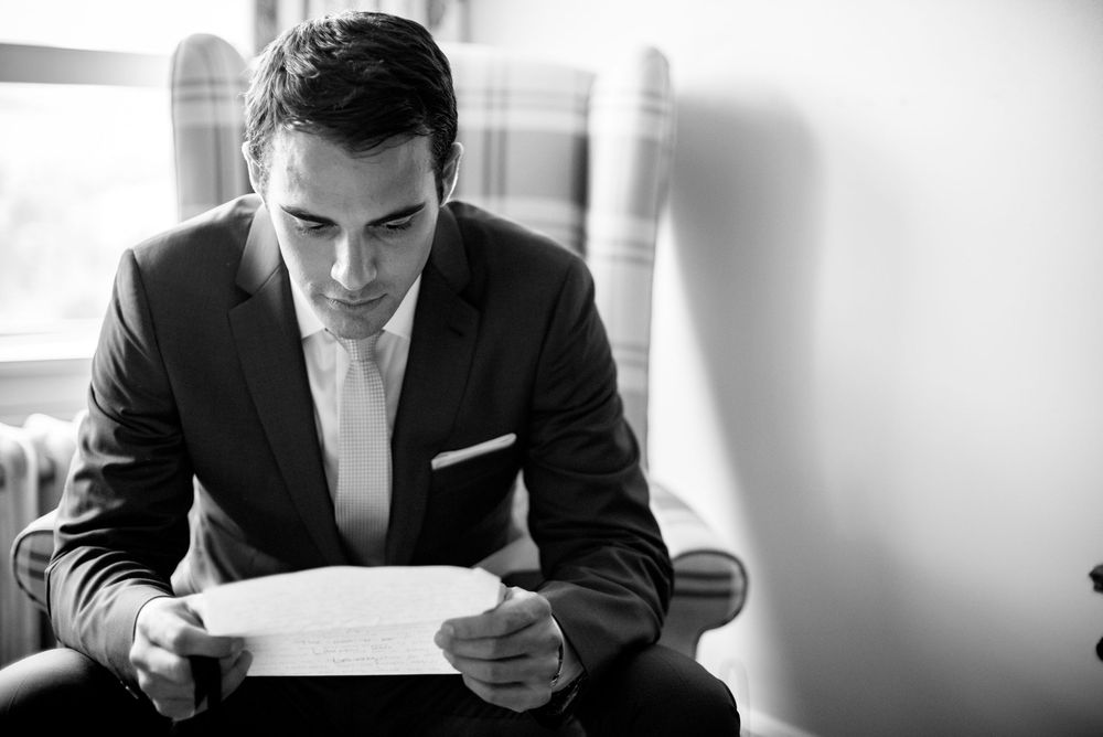 Black and white preparation shots of formal attire and accessories.