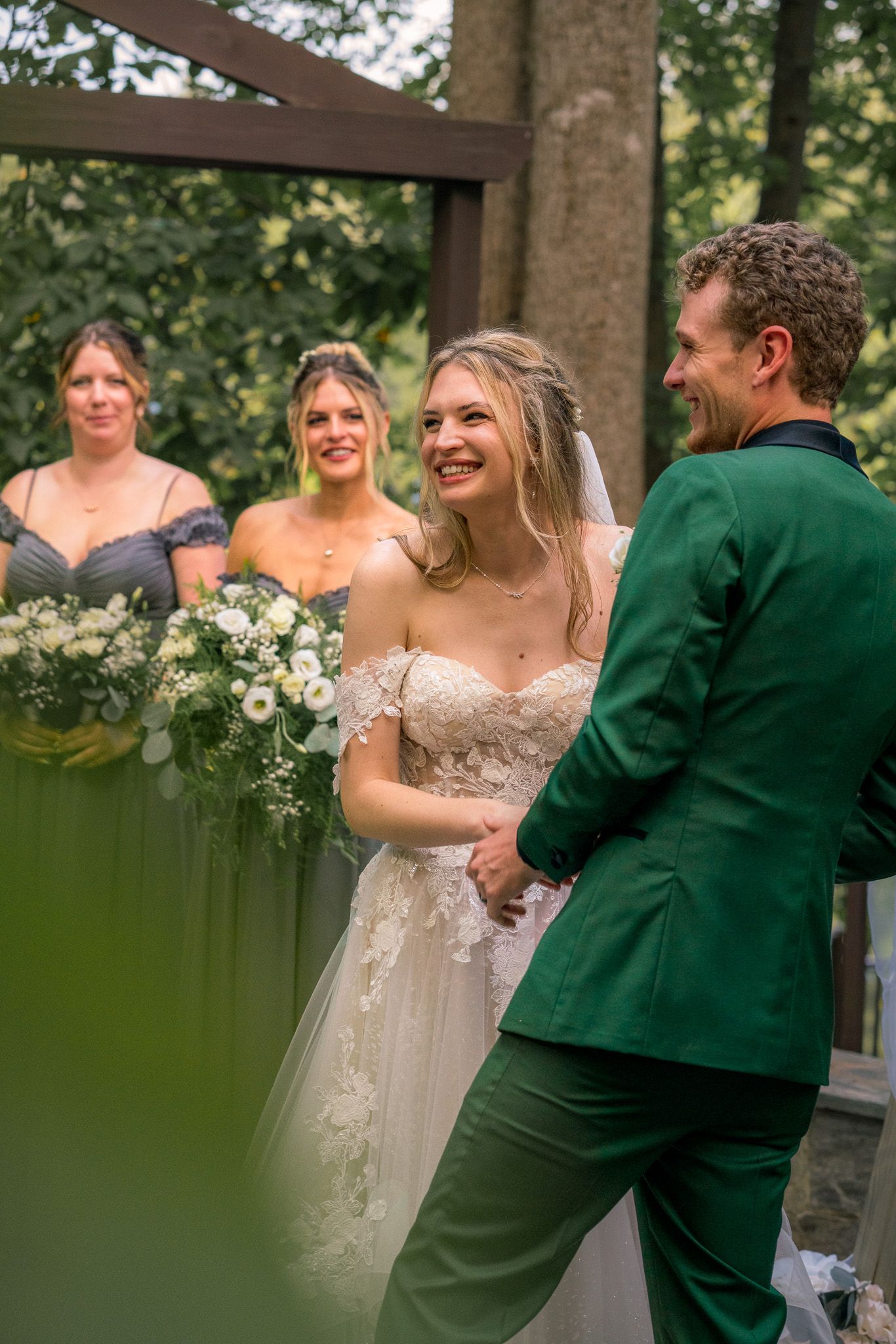 Wedding celebration showing joyful dancing moments in an outdoor venue.