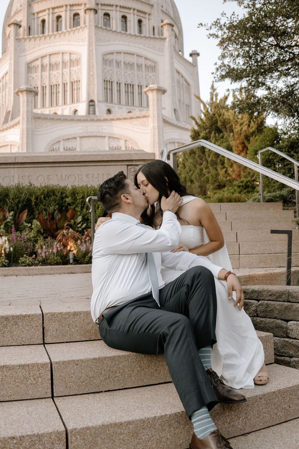 A couple shares romantic moments on the stone steps outside the Baha'i House of Worship in Wilmette, Illinois.