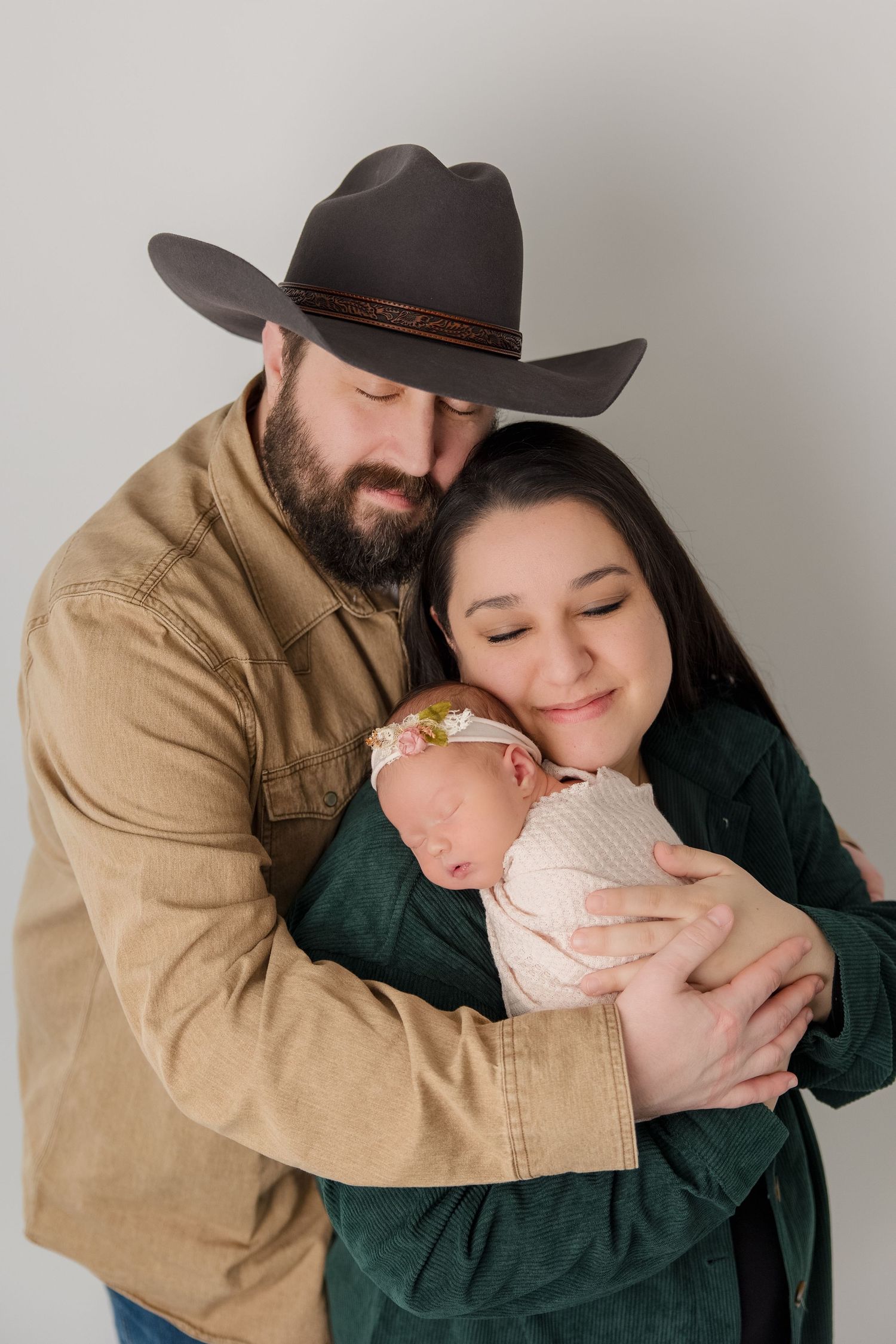 Close-up portrait of a couple in western attire showing intimate affection and tender embraces.