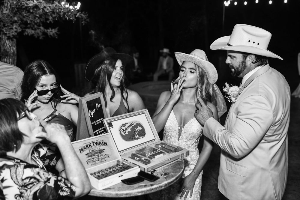 Candid cigar bar photos during a fall wedding reception at Whispering Oaks in Valley View, Texas