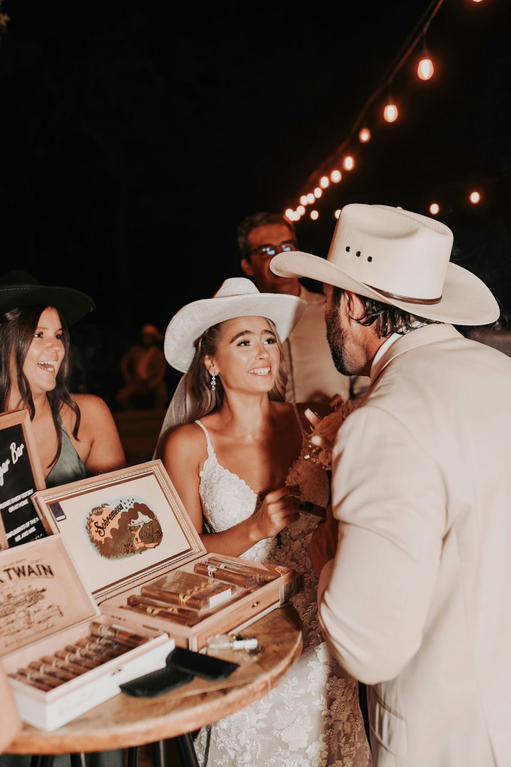 Candid cigar bar photos during a fall wedding reception