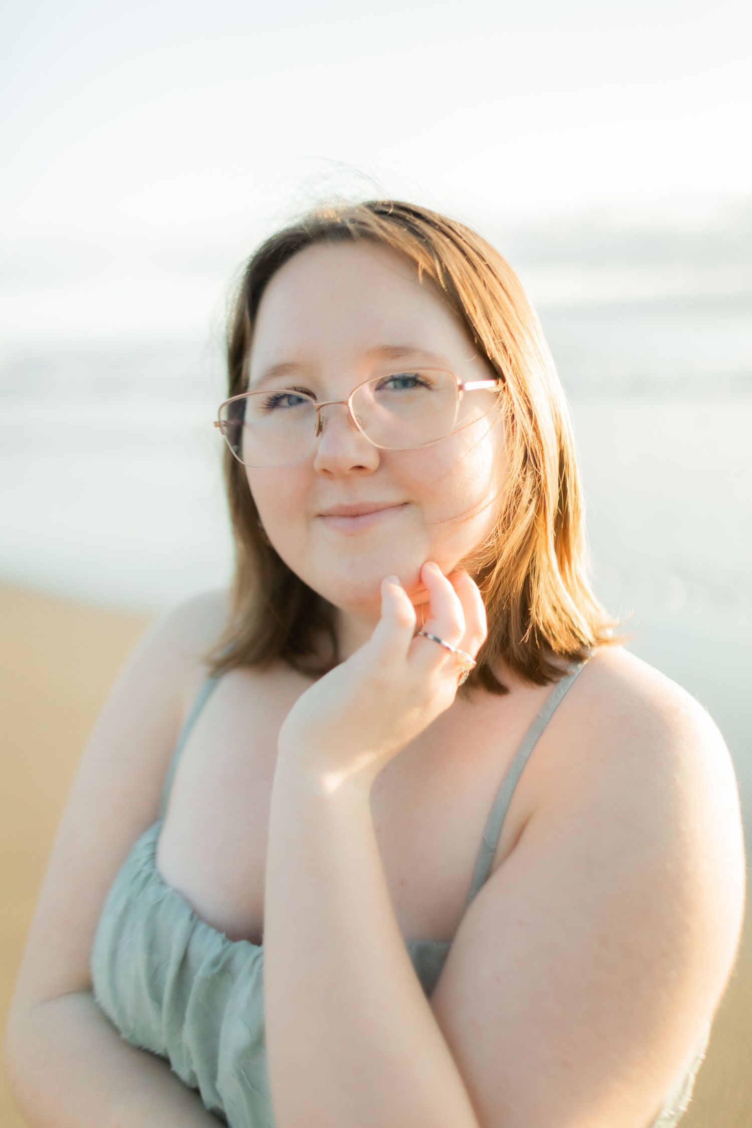 Beachside portrait series with soft natural lighting and ethereal mood.