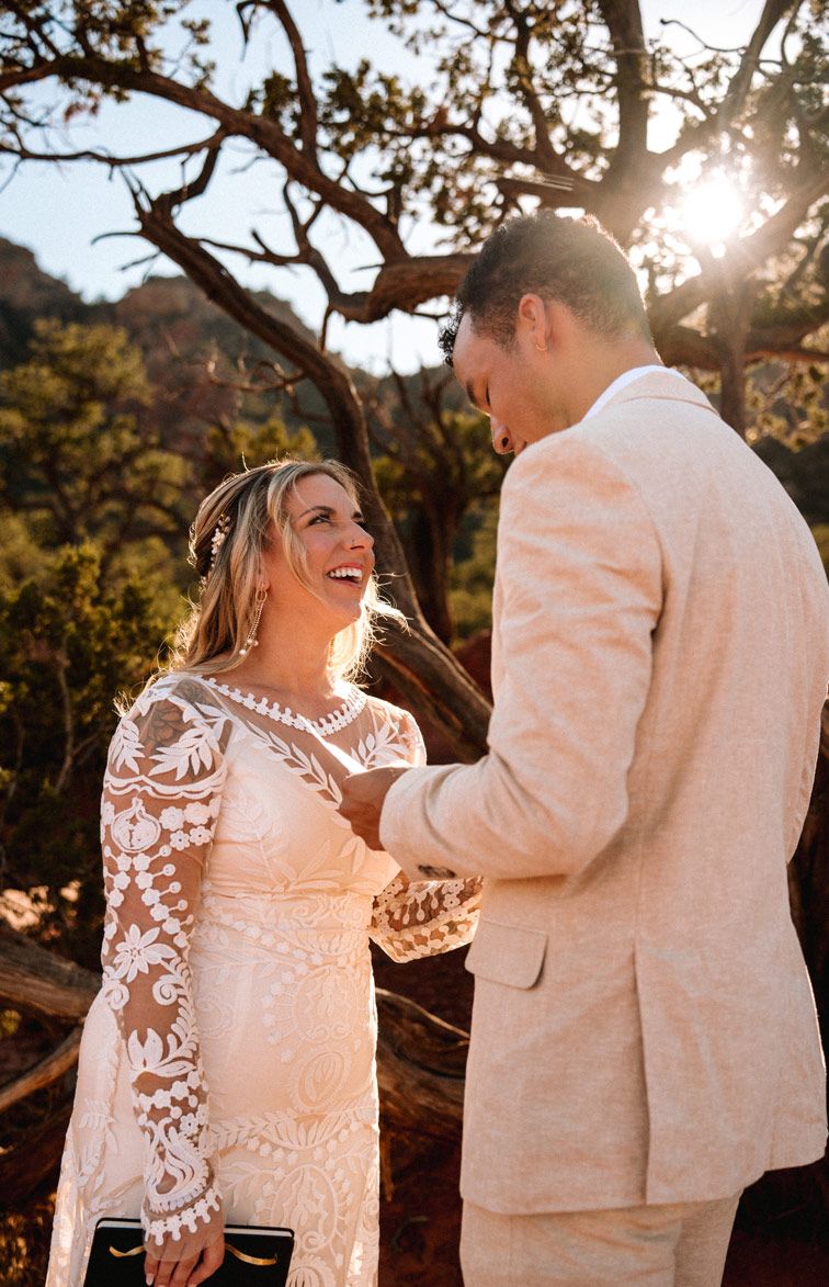 A candid moment of laughter shared during a Sedona desert wedding ceremony.