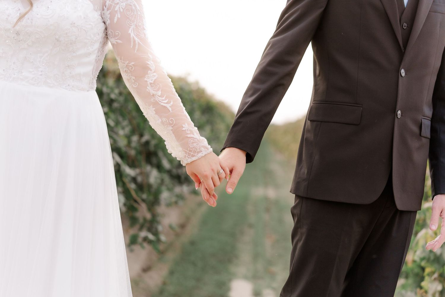 A couple shares an intimate moment during their first look on their wedding day.