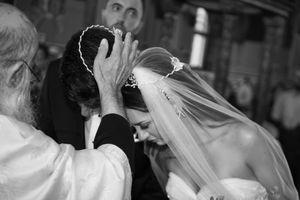 Motion-blurred black and white photo capturing wedding celebration moments.