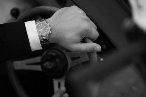 Close-up black and white detail shots of formal attire and hands.