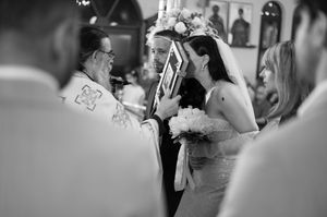 Religious wedding ceremony captured in black and white photography.