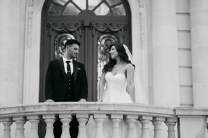Architectural wedding photo shoot at a white columned historic building.