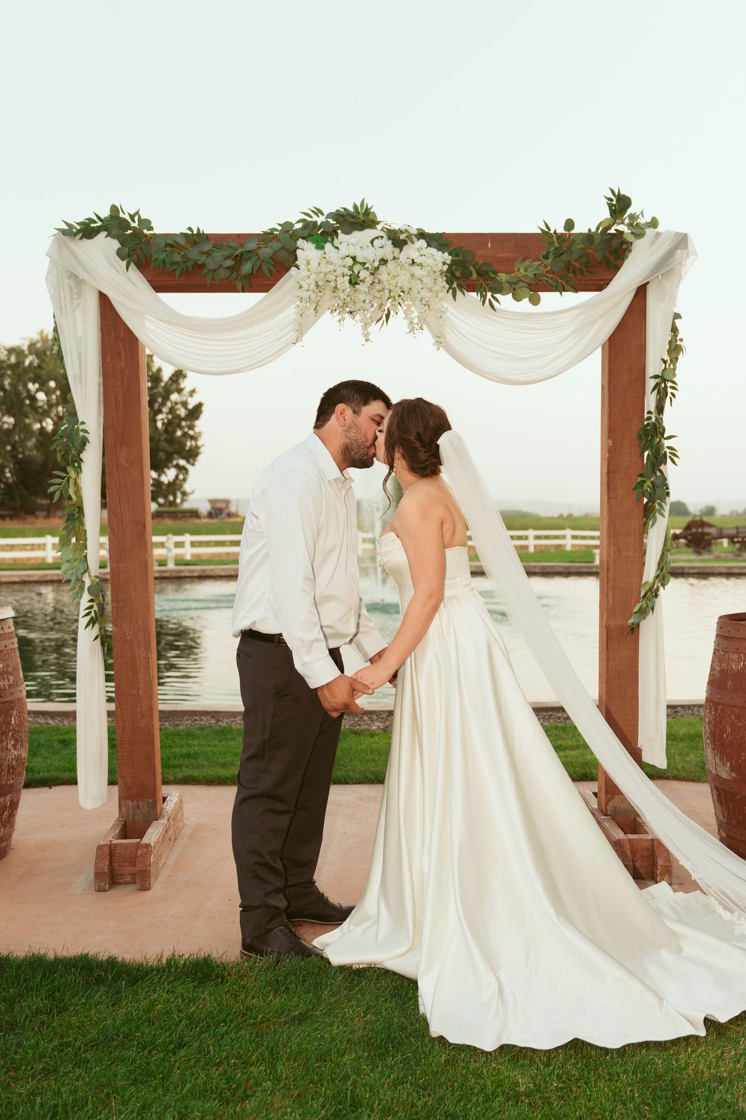 A romantic sequence of wedding photos showing a couple swaying and dancing together under a draped outdoor canopy.