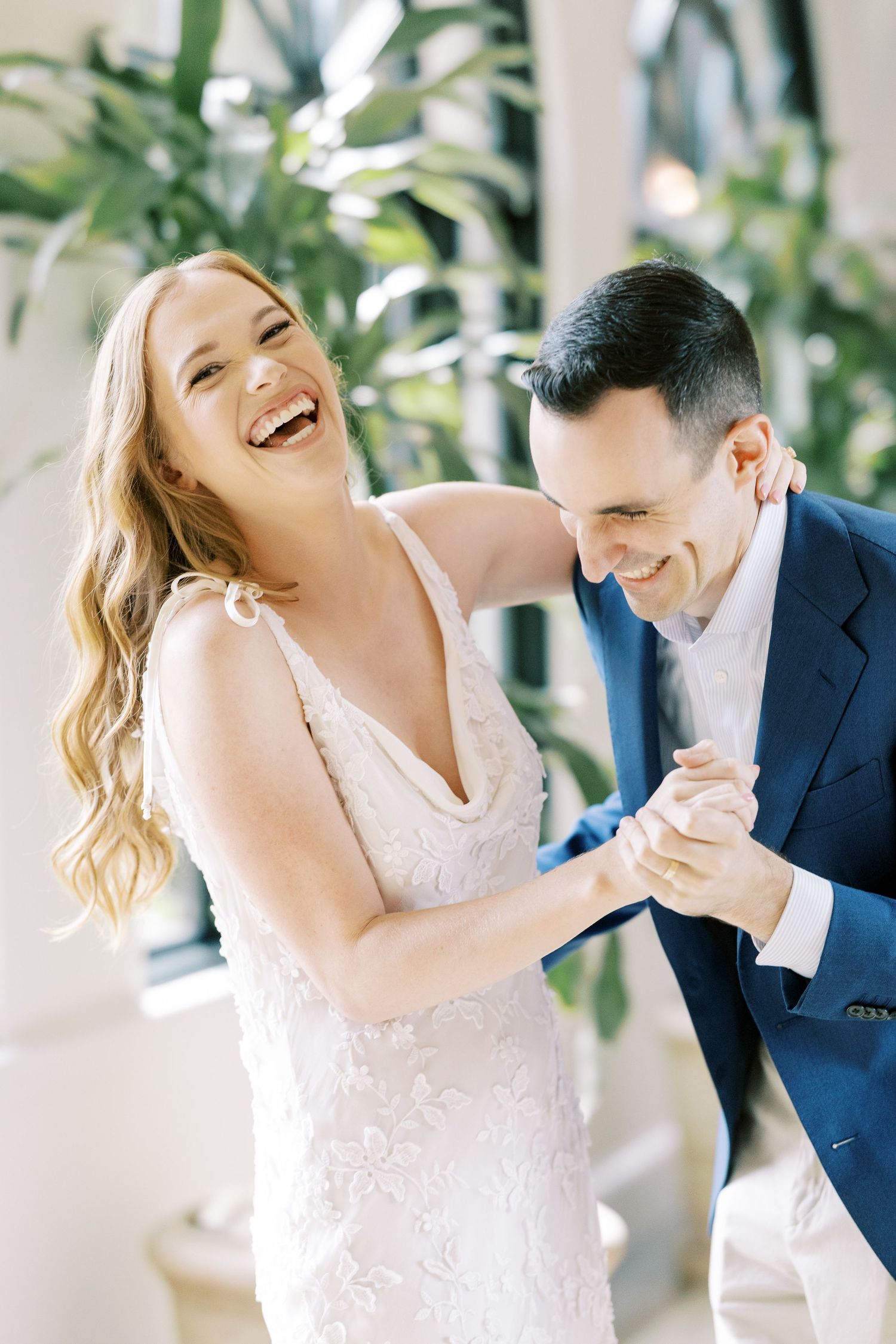 A sequence of five candid wedding photos showing the couple laughing and dancing together in a bright outdoor setting at Pendry Natirar.