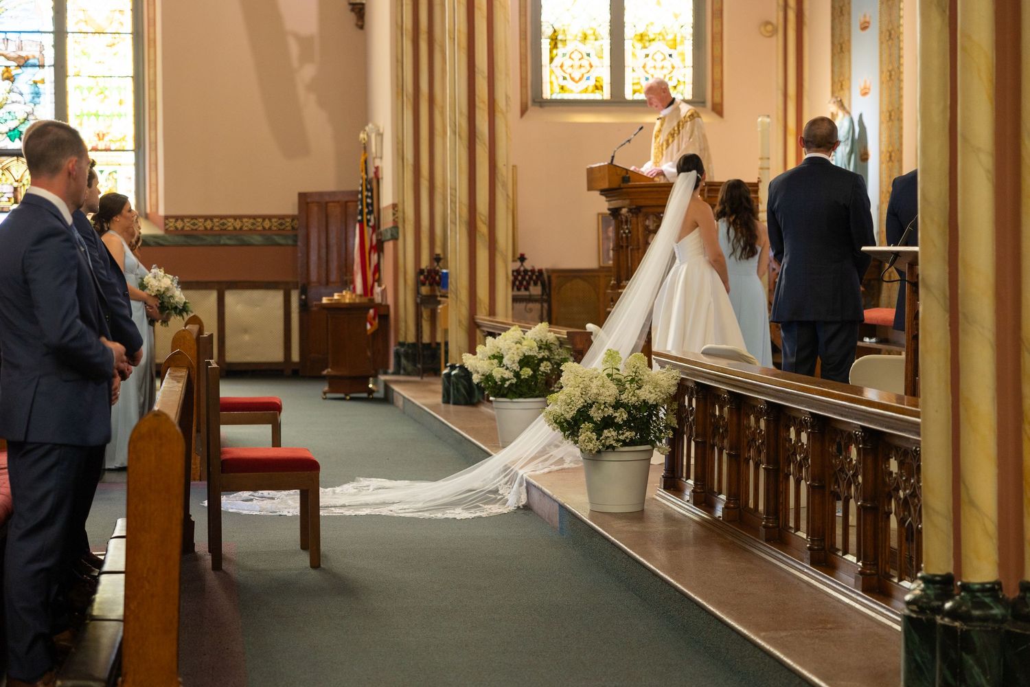 Several consecutive photos showing a wedding ceremony in a traditional church with warm lighting and wooden pews. Rachel Martinez